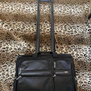 NEW BLACK TUMI ROLLING BRIEFCASE